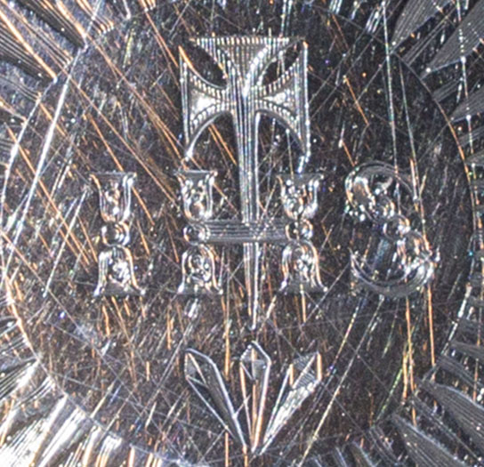 Central engraving with an Aveline style cross